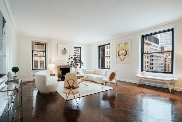 living room featuring dark parquet floors and ornamental molding