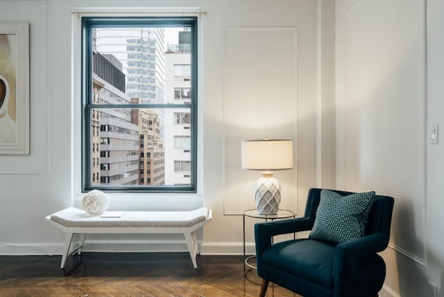 sitting room featuring dark parquet floors