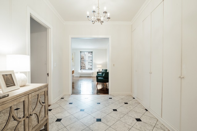 hallway with a notable chandelier, light tile patterned floors, and ornamental molding