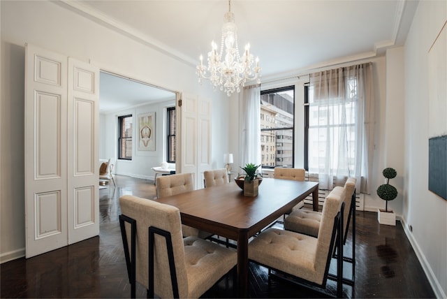 dining area with a notable chandelier and ornamental molding