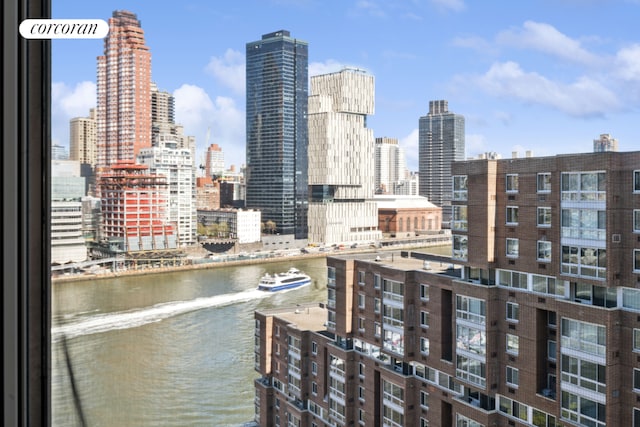 property's view of city featuring a water view