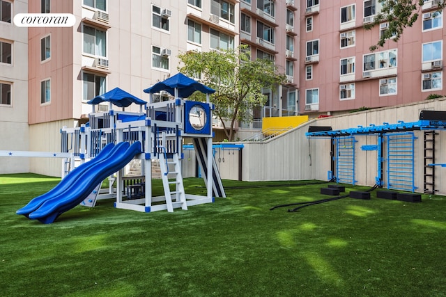 communal playground featuring a yard