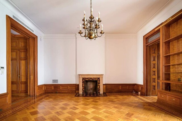 dining room with an inviting chandelier and light parquet flooring