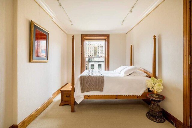 interior space featuring an inviting chandelier, parquet flooring, brick wall, and plenty of natural light