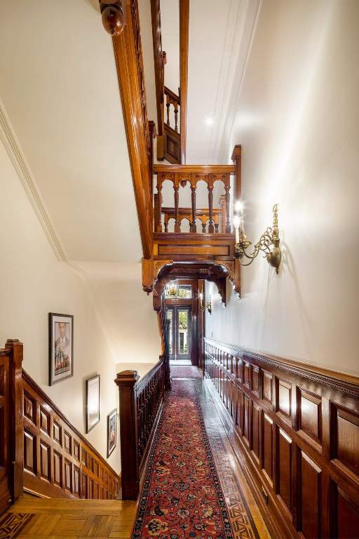 bedroom featuring a premium fireplace and crown molding