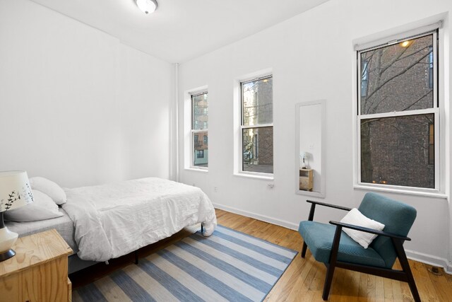 bedroom with wood-type flooring