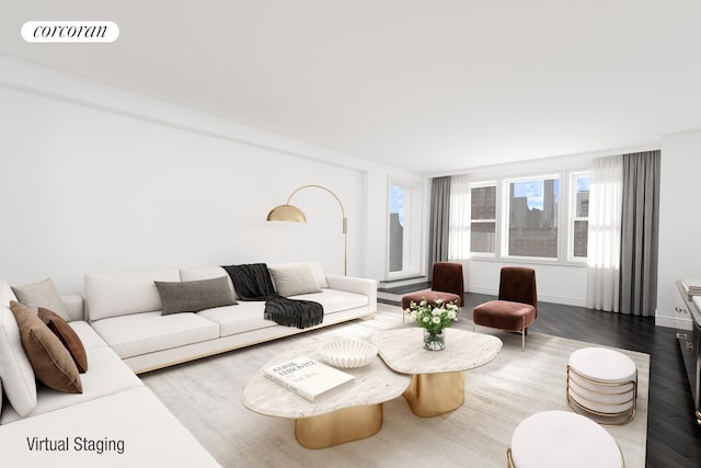 living area with visible vents, baseboards, and wood finished floors