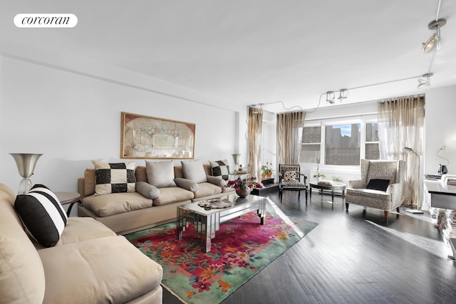 living room featuring visible vents and wood finished floors