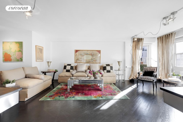 living room featuring dark wood-type flooring and visible vents