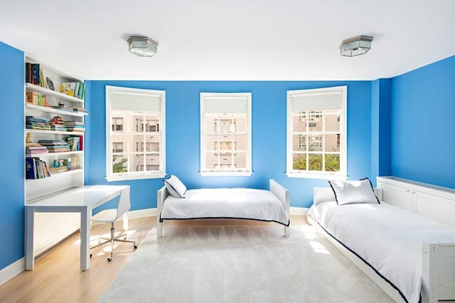 bedroom with light hardwood / wood-style floors