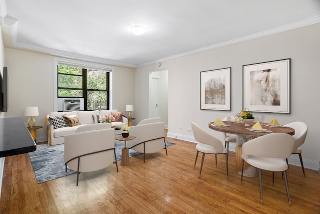 living room featuring cooling unit, crown molding, and hardwood / wood-style flooring