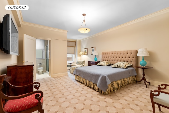 bedroom featuring baseboards, ensuite bath, and crown molding