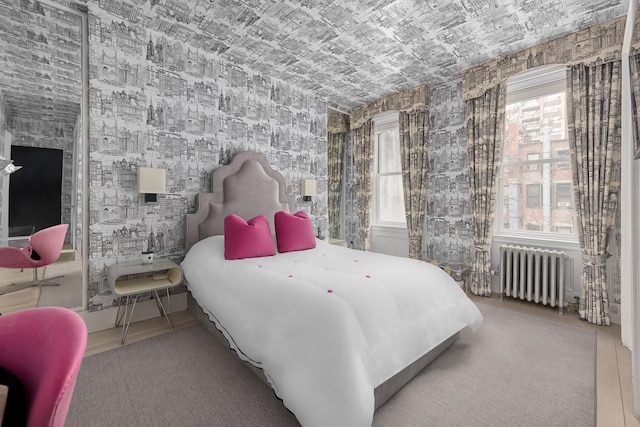 116 E 61st St, New York City, NY 10021 - bedroom featuring radiator and multiple windows