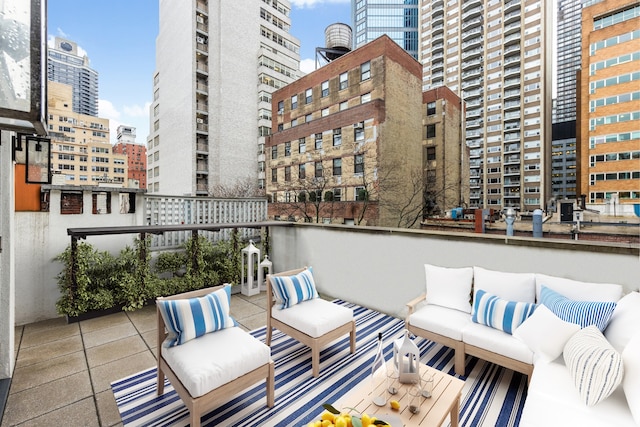 116 E 61st St, New York City, NY 10021 - balcony with outdoor lounge area and a city view