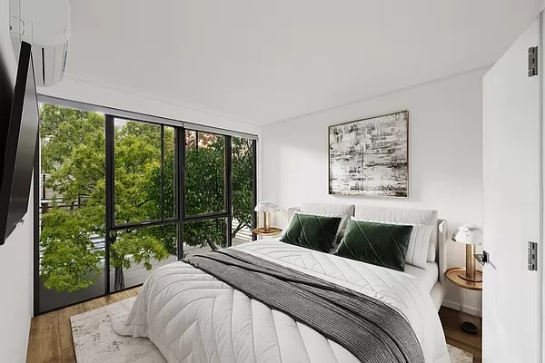 bedroom with hardwood / wood-style floors