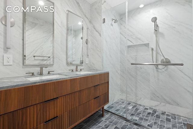 bathroom with an enclosed shower and vanity