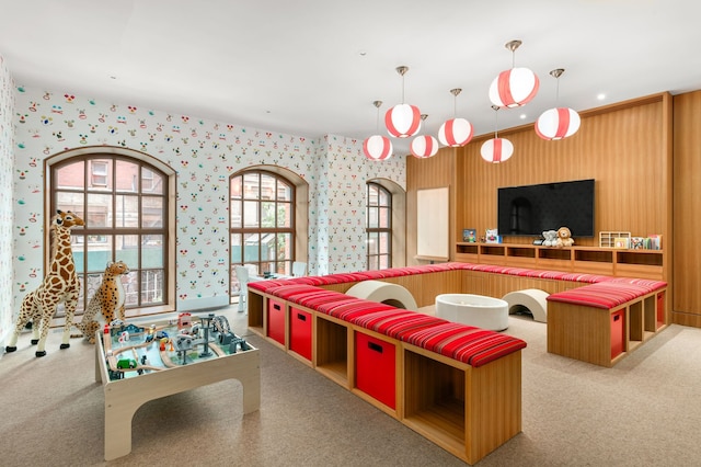 100 Vandam St Unit 20-A, New York City, NY 10013 - recreation room featuring wallpapered walls, plenty of natural light, and carpet floors