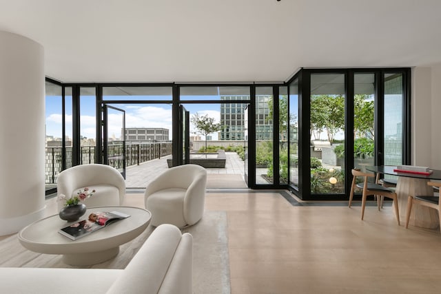 100 Vandam St Unit 20-A, New York City, NY 10013 - living area with floor to ceiling windows and wood finished floors