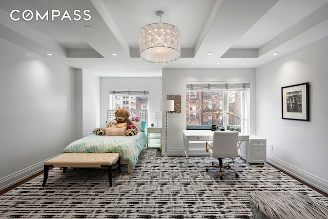 bedroom featuring a tray ceiling, recessed lighting, and baseboards