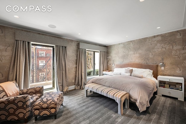 bedroom with wallpapered walls, ornamental molding, dark colored carpet, and recessed lighting