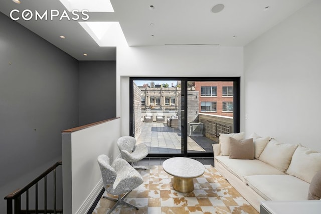 living room featuring a skylight