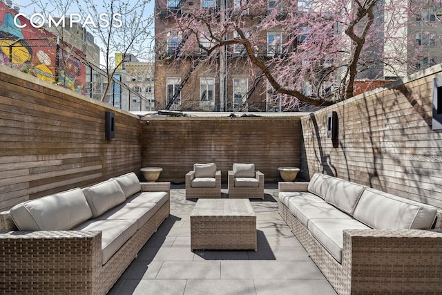 view of patio featuring a fenced backyard and outdoor lounge area