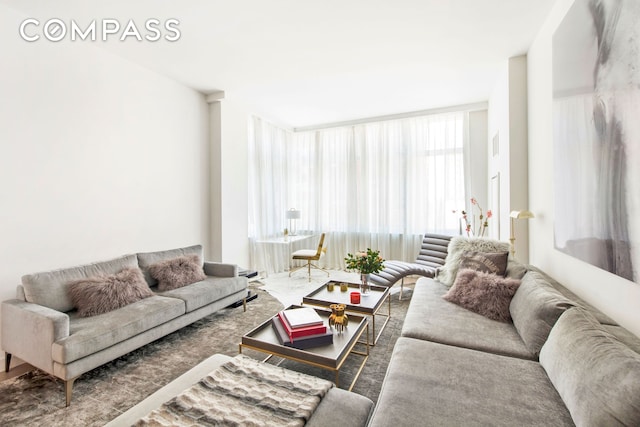 living area with floor to ceiling windows