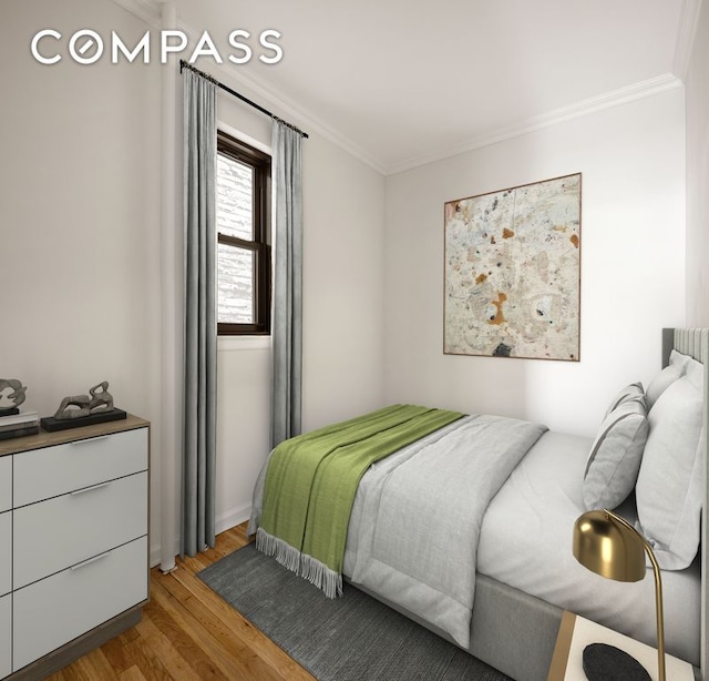 bedroom with crown molding and wood finished floors