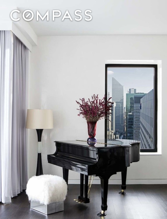 20 W 53rd St Unit 42A, New York City, NY 10019 - living area with baseboards and wood finished floors