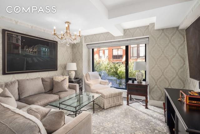 living area with baseboards, an inviting chandelier, and wallpapered walls