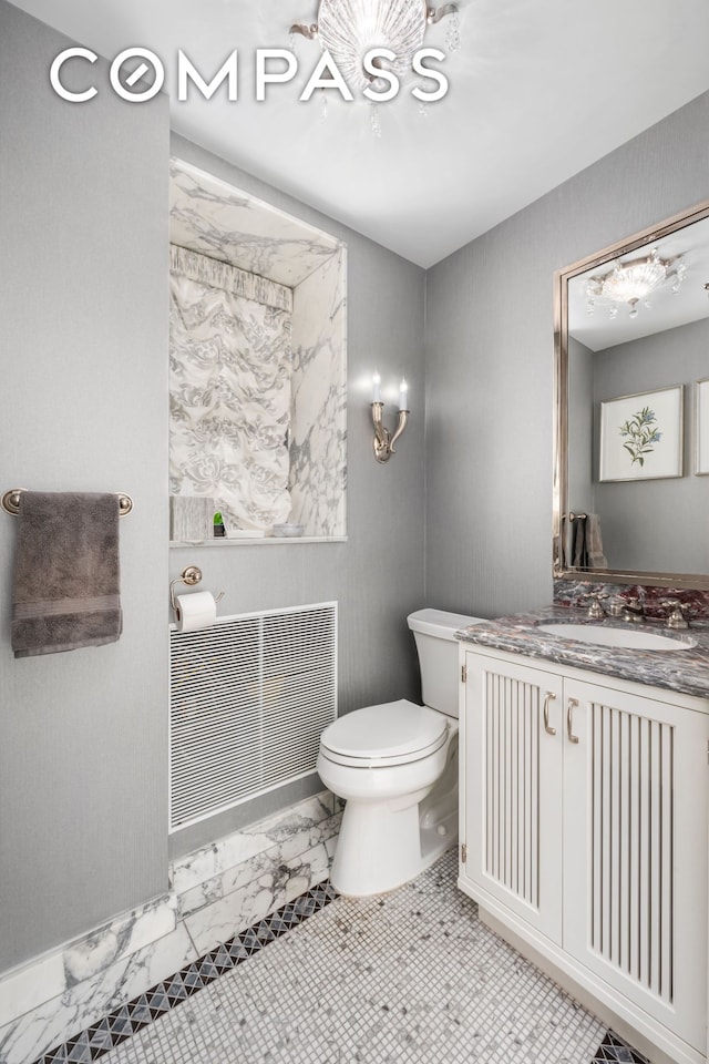 bathroom with visible vents, marble finish floor, vanity, and toilet