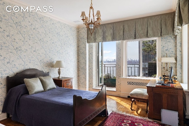 bedroom featuring wallpapered walls, light wood-style flooring, a chandelier, and crown molding