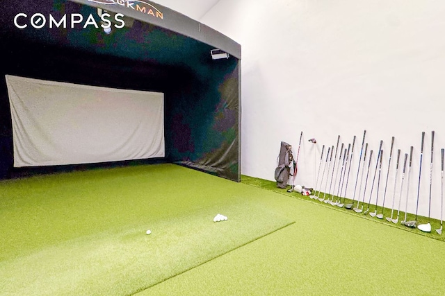 rec room featuring golf simulator and carpet