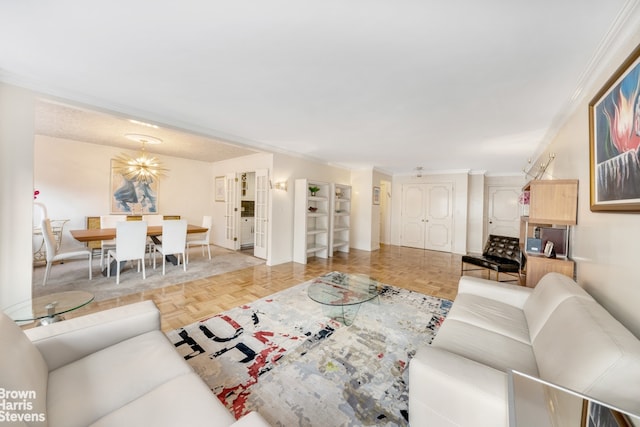 living room with crown molding and baseboards