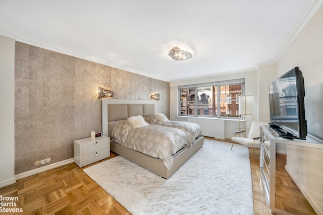 bedroom with baseboards and crown molding