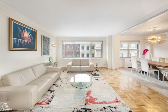 living area featuring ornamental molding, a chandelier, and baseboards