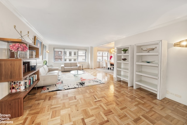 living room with crown molding and baseboards