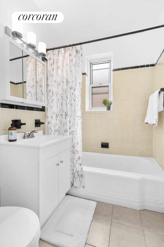 full bathroom with tile patterned flooring, toilet, vanity, and shower / tub combo with curtain