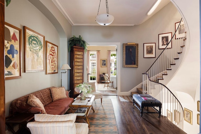 living room featuring crown molding and dark hardwood / wood-style floors