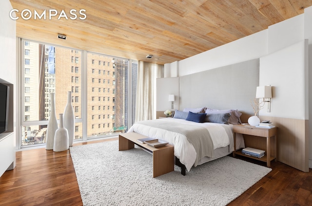 bedroom with access to outside, dark wood-type flooring, a wall of windows, and wood ceiling