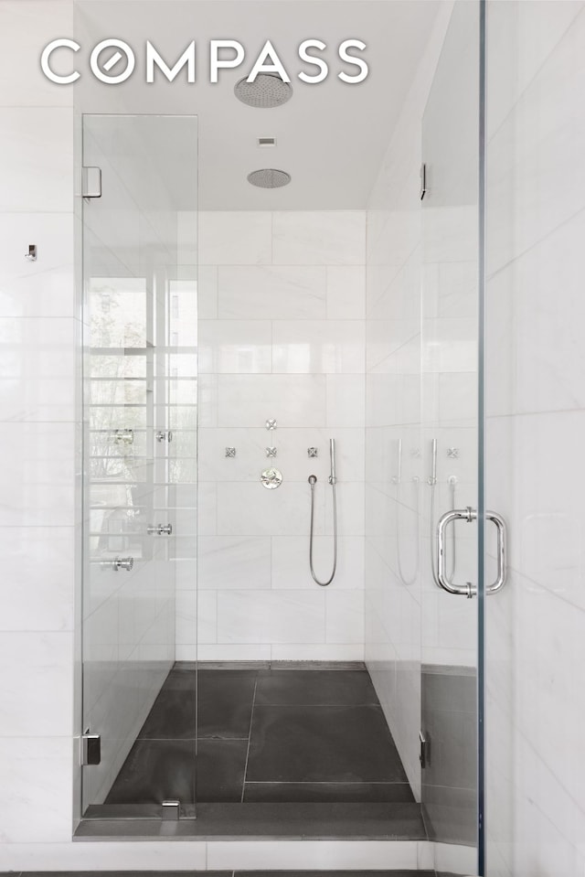 bathroom featuring a shower stall