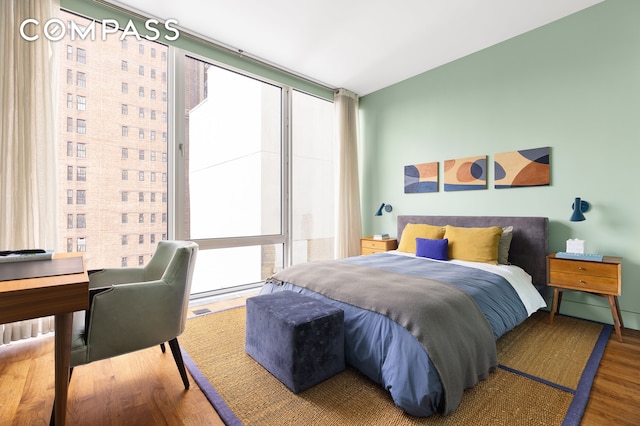 bedroom featuring wood finished floors