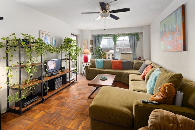 living area featuring a ceiling fan