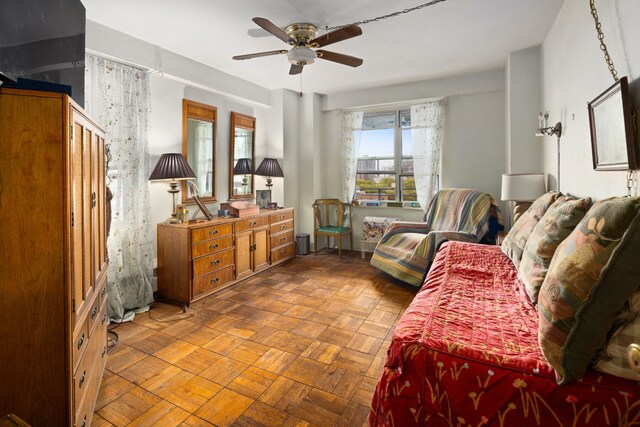 home office with parquet floors and ceiling fan with notable chandelier