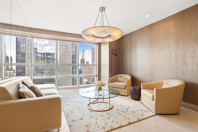 living room featuring light tile patterned floors and wooden walls