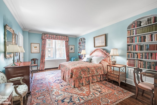 bedroom featuring dark wood-type flooring and ornamental molding