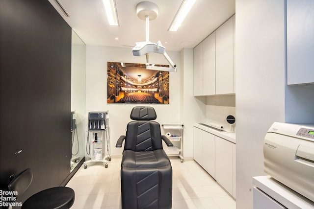 home office featuring light tile patterned floors and washer / clothes dryer