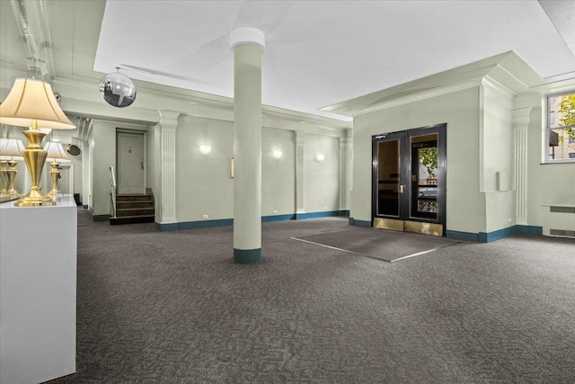 interior space with radiator and french doors