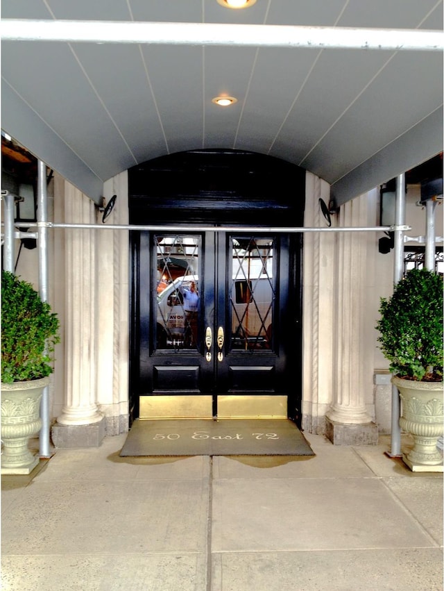 view of exterior entry featuring french doors