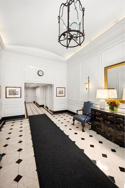 interior space with vaulted ceiling and a notable chandelier